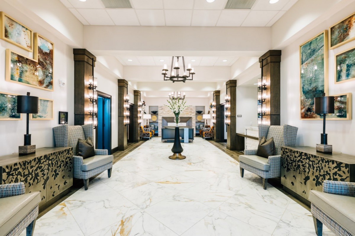 Luxurious hotel lobby with marble floors and elegant seating.