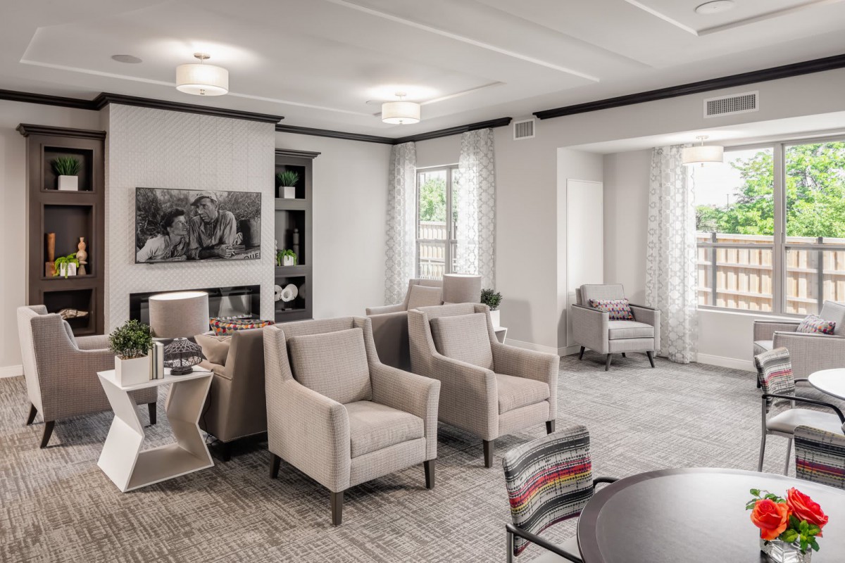 A modern and elegant living room with neutral-toned furniture and decor.