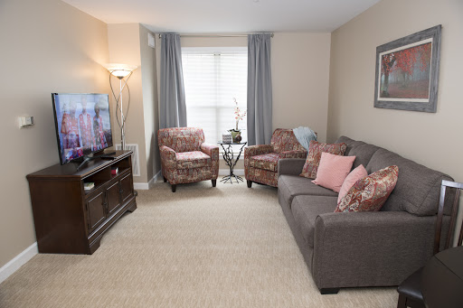 A cozy living room featuring comfortable seating and a television.