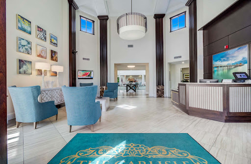 A spacious and elegantly designed lobby with modern furnishings and ample natural light.