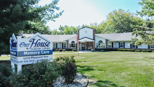 A memory care facility showcasing a welcoming exterior and well-maintained landscape.