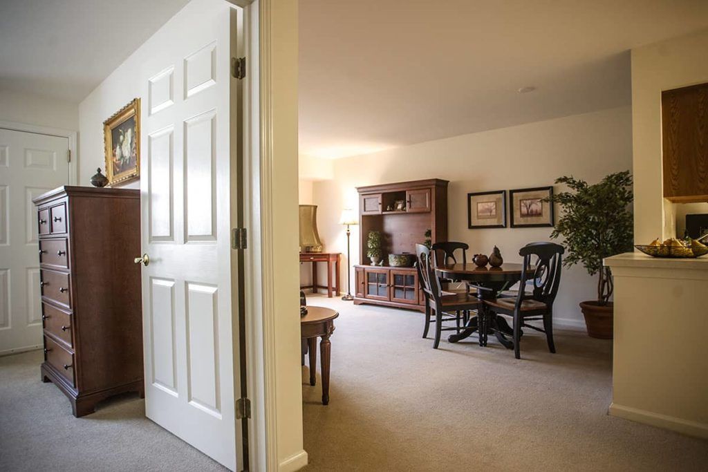 A cozy living room with a dining area and classic decor.