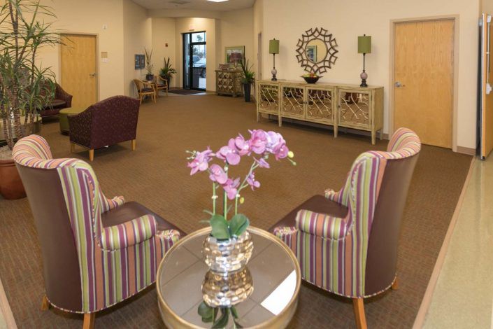 A cozy and stylish waiting area with comfortable seating and elegant decor.