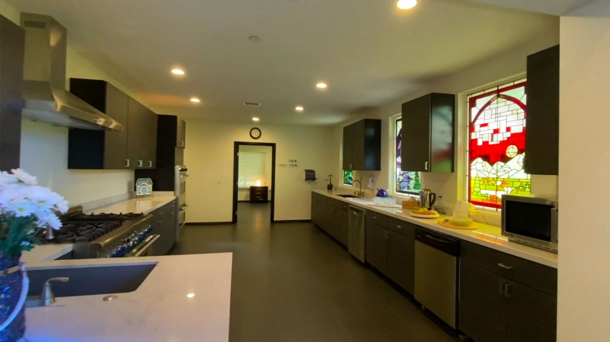 A modern, spacious kitchen with ample countertop space and bright lighting.