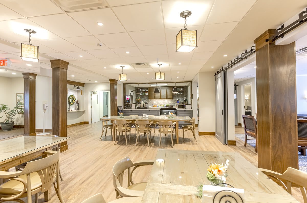 A modern dining area with a spacious kitchen and stylish decor.