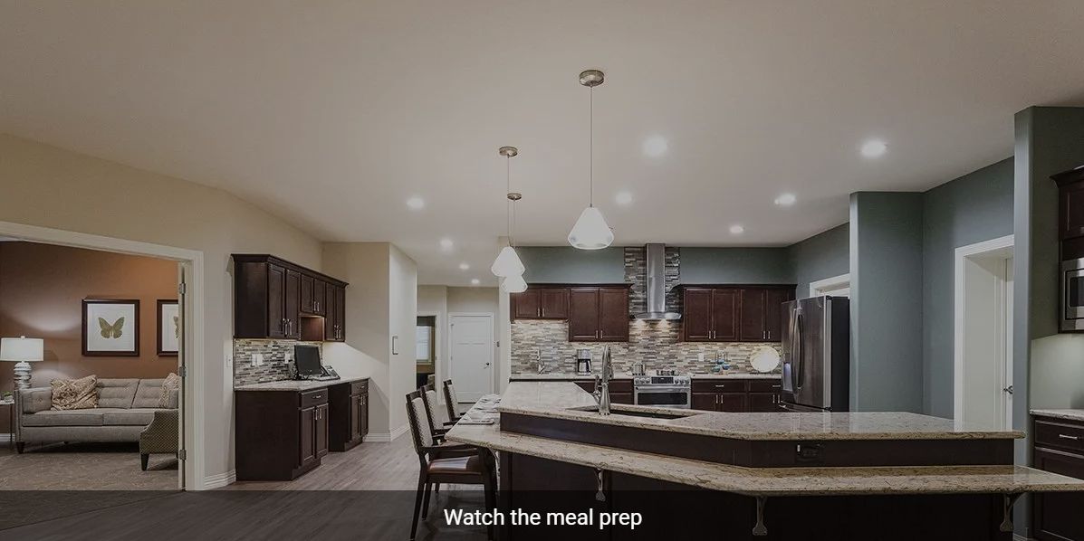 A modern kitchen with elegant lighting and spacious countertops.