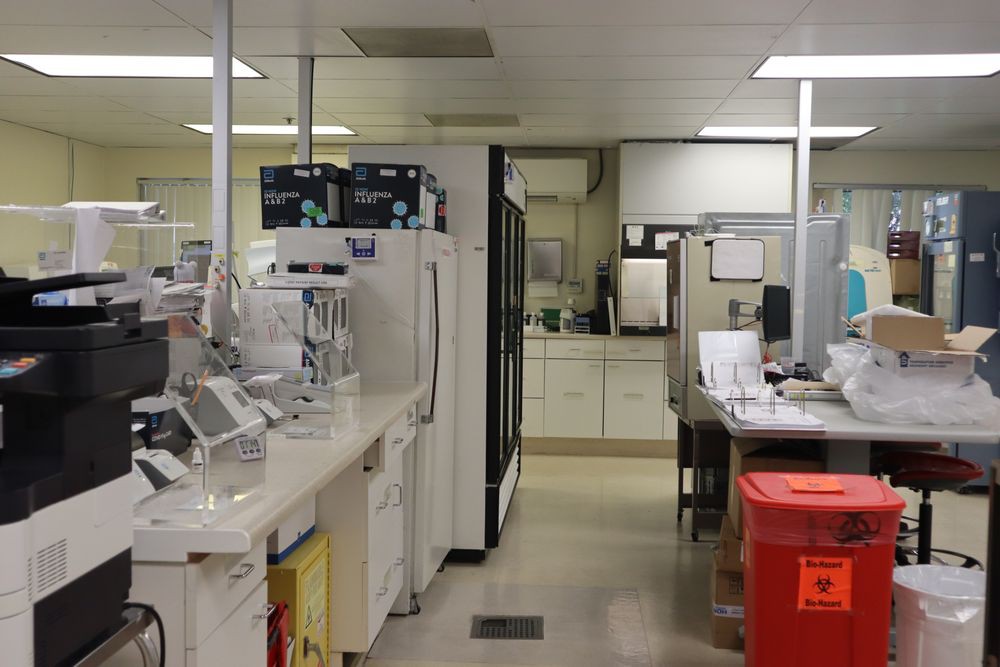 A well-equipped laboratory workspace with various scientific equipment and technology.