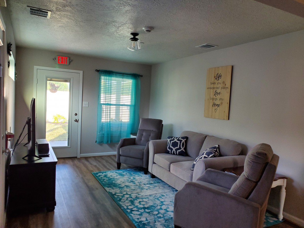 A cozy living room with comfortable seating and decorative accents.