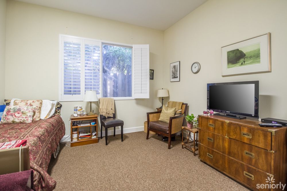 A cozy living room with comfortable seating and a television.