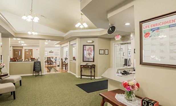 A welcoming reception area with comfortable seating and floral decorations.