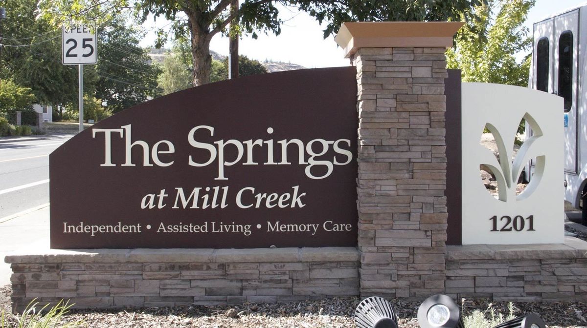 Entrance sign for The Springs at Mill Creek, a community offering independent and assisted living as well as memory care.