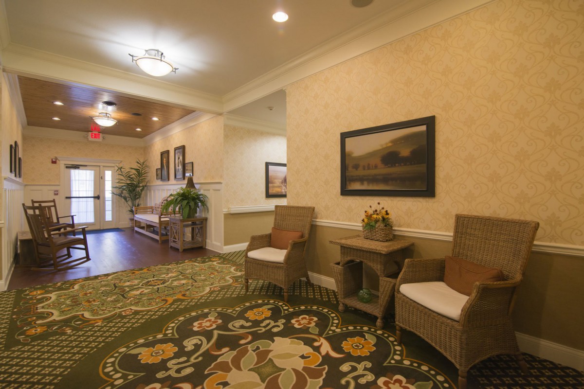 A cozy lobby with seating and decorative elements.