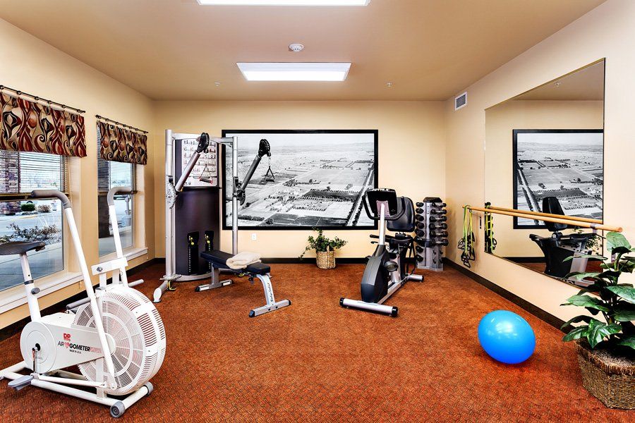 A well-equipped gym with various fitness machines and equipment.