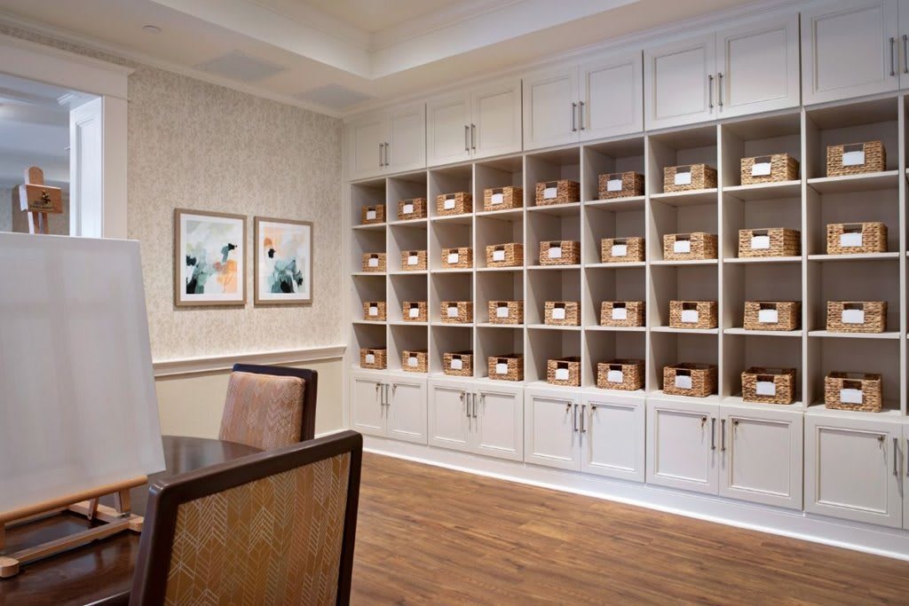 A neatly organized room with shelves filled with labeled boxes.