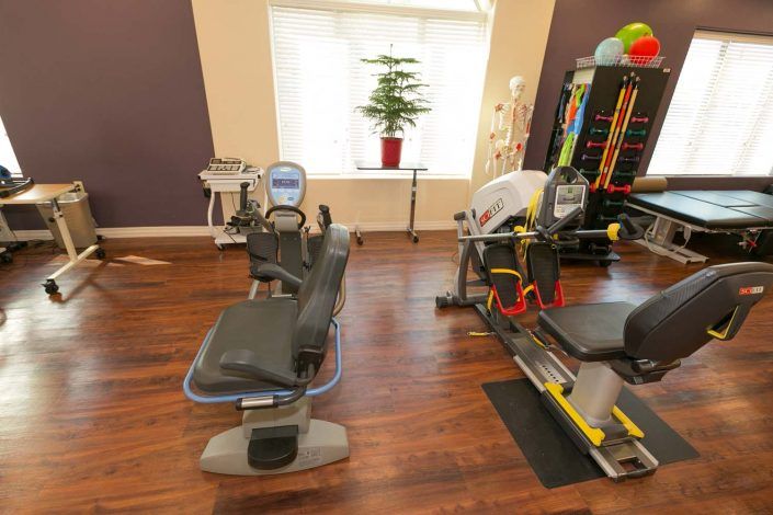 A well-equipped gym with exercise machines and a variety of fitness tools.