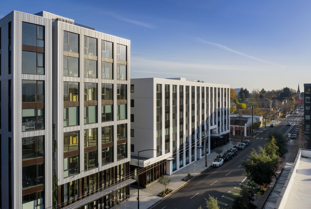 A modern office building in an urban setting during the day.