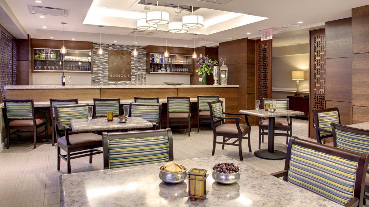 A modern dining area featuring elegant furniture and ambient lighting.
