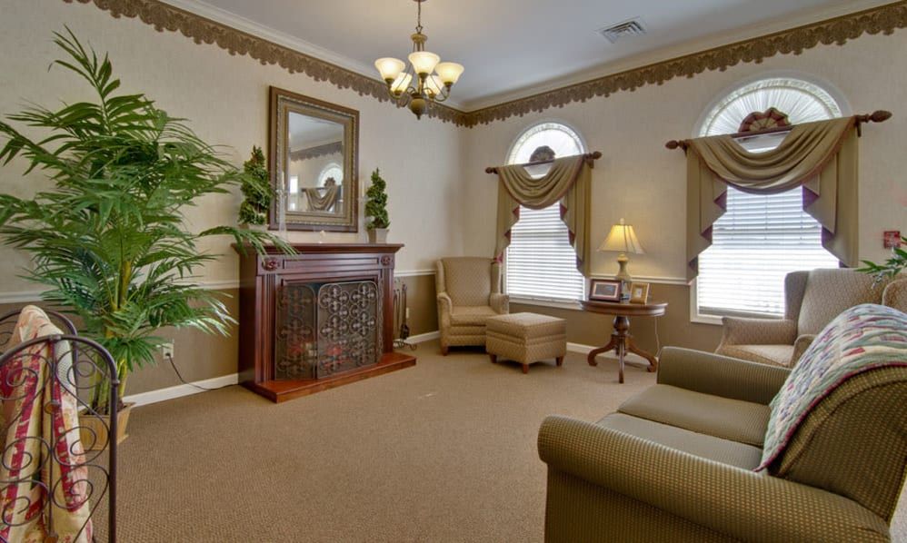 A classic-styled living room with elegant furnishings and warm lighting.
