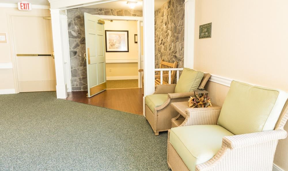 A cozy hallway with comfortable seating and decorative elements.