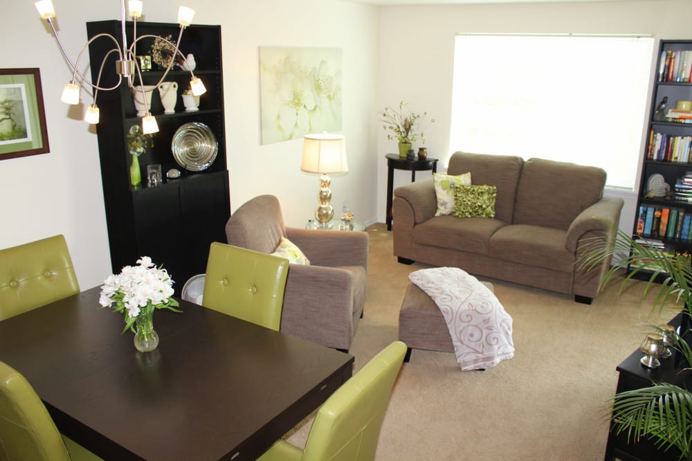 A modern living room with cozy furniture and stylish decor.