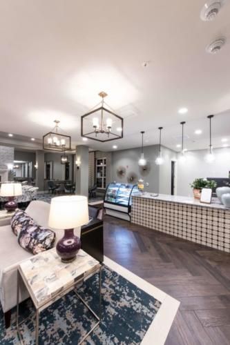 A modern lobby area with stylish lighting and a reception desk.