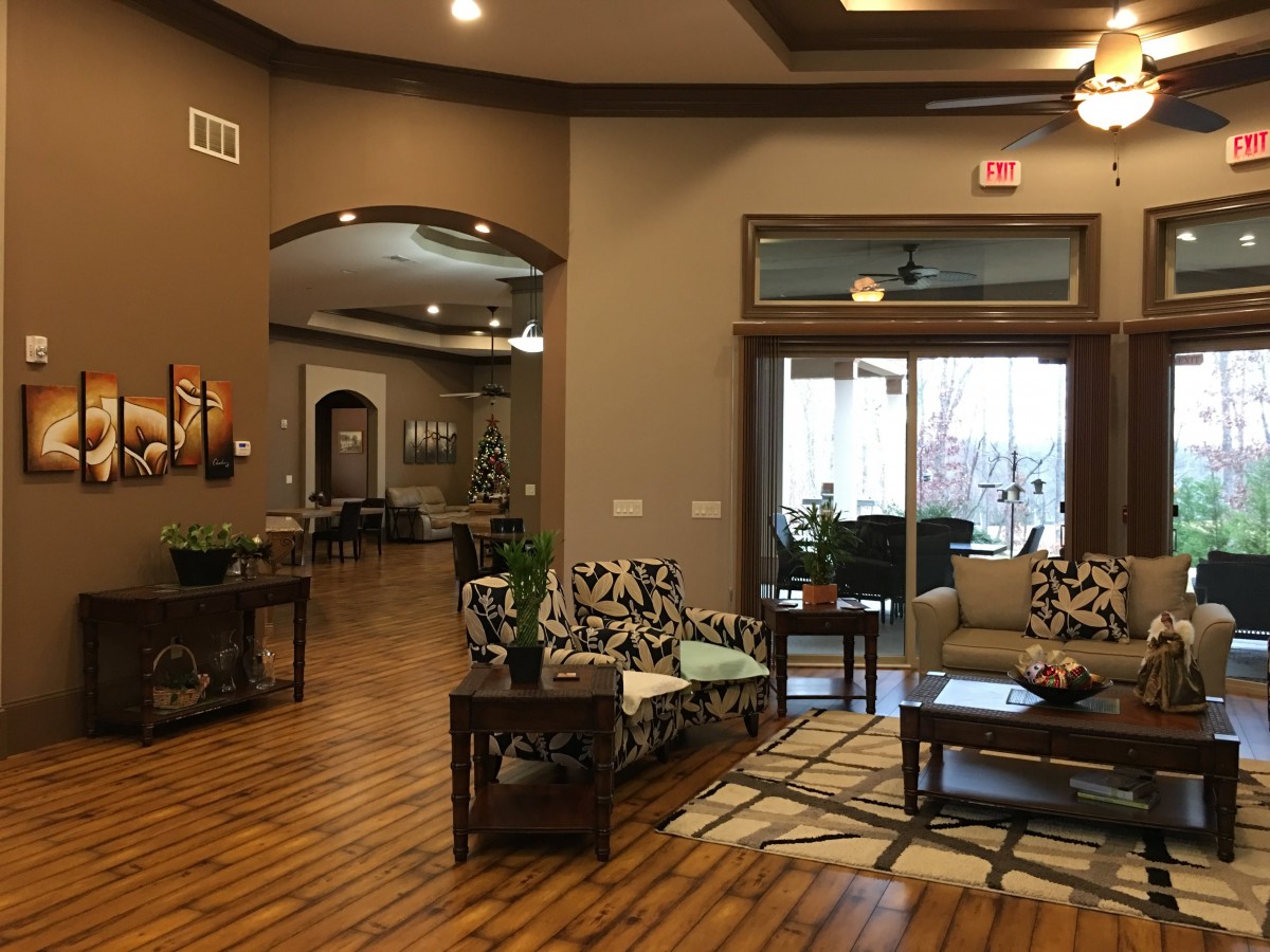 A modern lobby with comfortable seating and wood flooring.