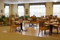 Cozy dining area with neatly arranged tables and chairs.