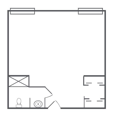 A simple floor plan layout with designated areas for a bathroom and open space.