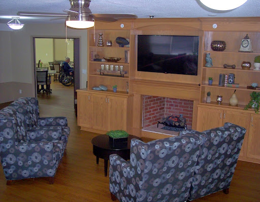 A cozy living room featuring comfortable seating and a television.