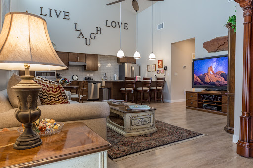 A stylish and inviting living room featuring modern decor, warm lighting, and an open layout.