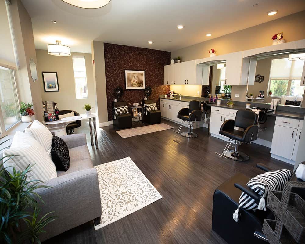 A modern open-concept living room and kitchen with stylish furniture and contemporary decor.