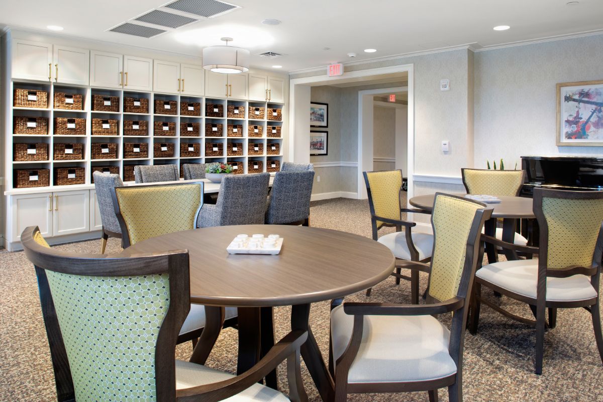 A well-designed dining area with multiple tables and chairs, featuring a modern and elegant interior.