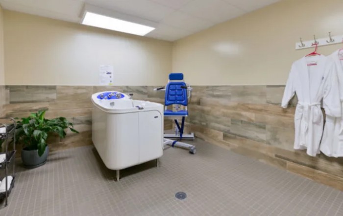 A therapy room equipped with specialized exercise equipment for physical rehabilitation.