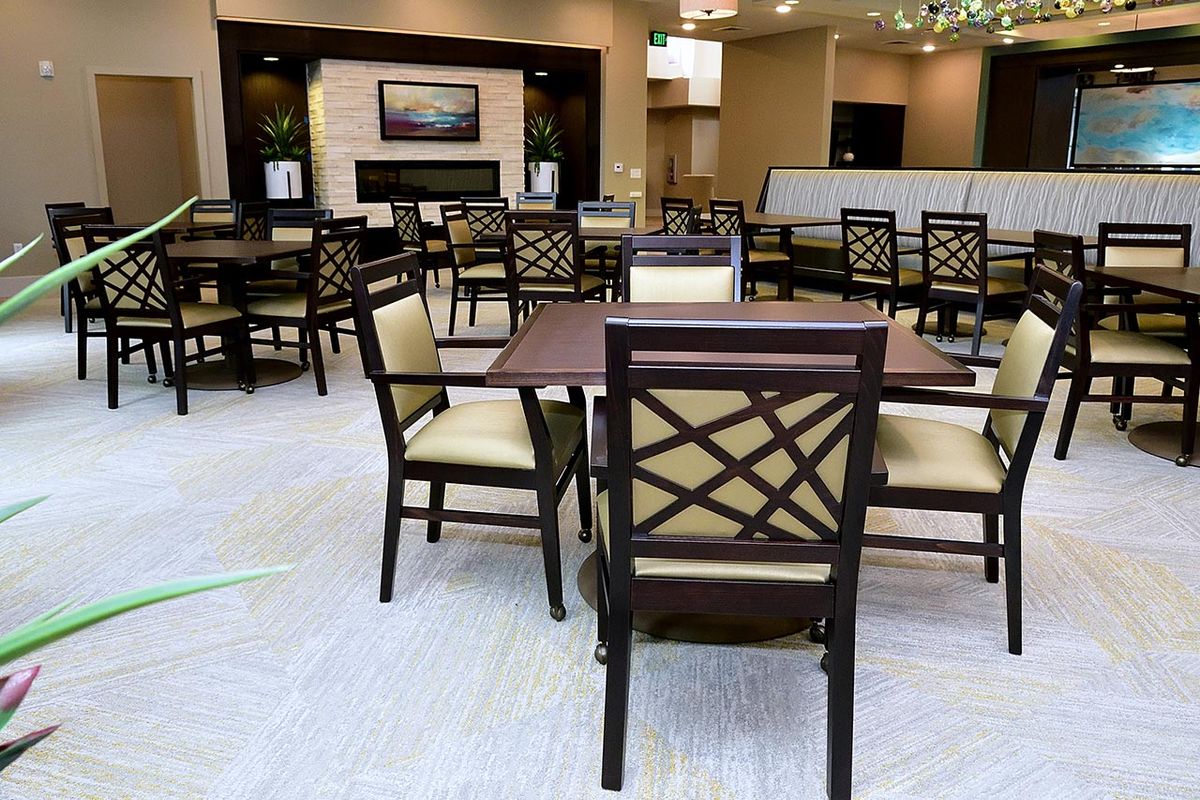 An indoor dining area with neatly arranged tables and chairs.