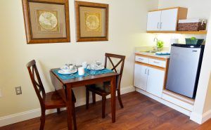 Cozy kitchenette with a dining setup for two.