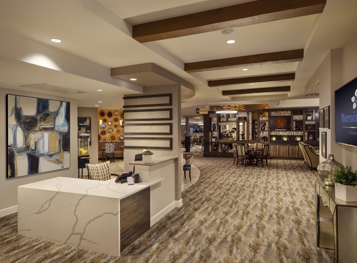 A modern hotel lobby with stylish interior design and ambient lighting.