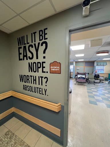 A motivational message on the wall of a healthcare facility, encouraging resilience and determination.
