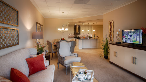 A beautifully designed living room featuring elegant furnishings and warm lighting.