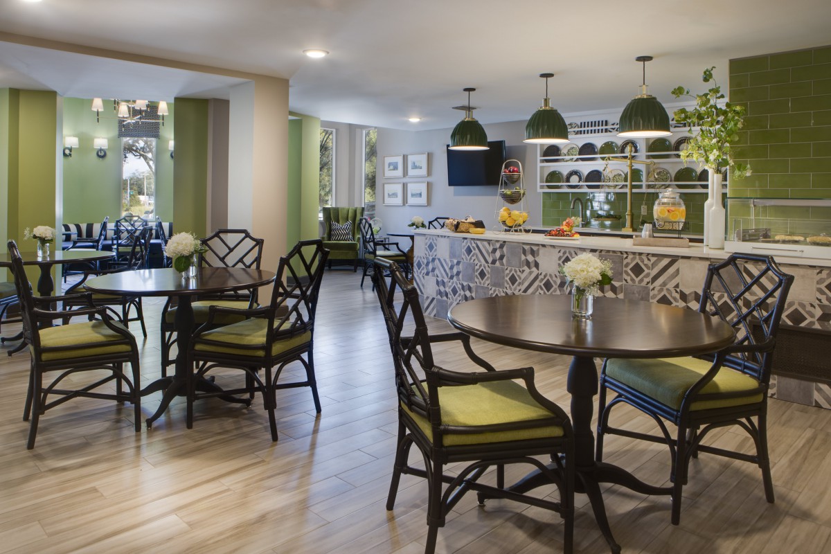 A modern and stylish dining area with elegant furniture and decor.