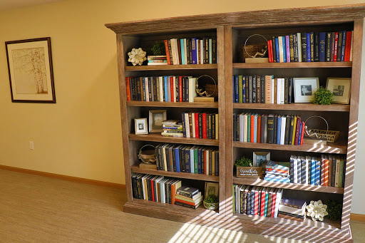 A beautifully arranged bookshelf filled with various books and decorative items.