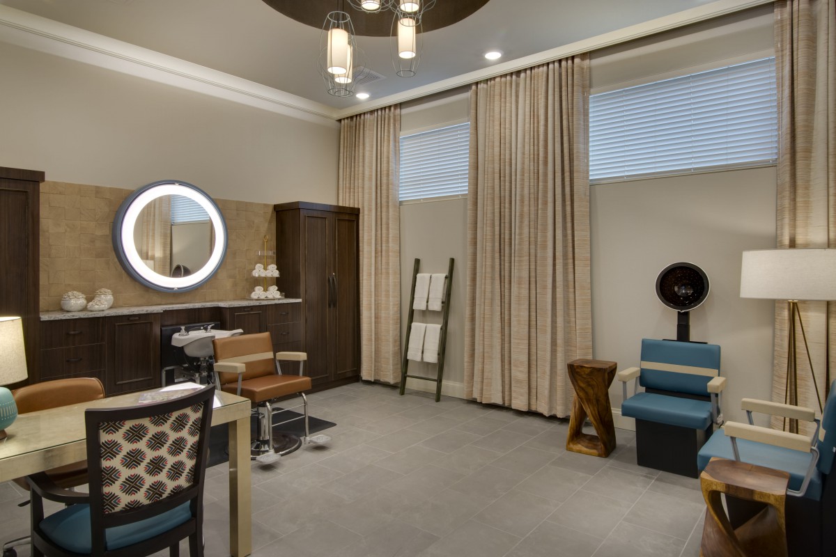 A modern living room with stylish furniture and elegant lighting.