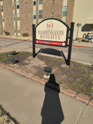 Entrance sign for Washington Heights apartment complex.