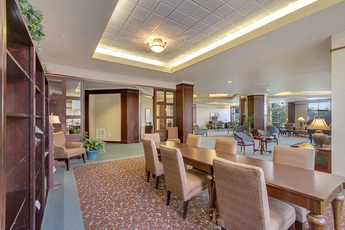 Comfortable lounge area with tables and seating, featuring elegant lighting and decor.