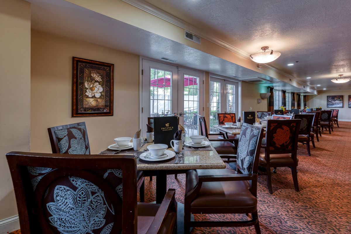 A well-decorated dining area with tables set for a meal.