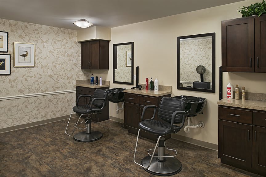 A modern salon interior with hairdressing stations and mirrors.