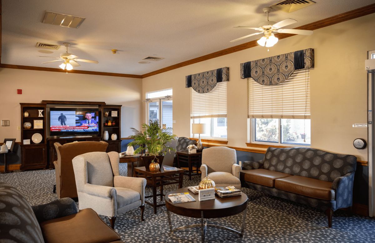 A cozy living room with comfortable seating, a television, and tasteful decor.