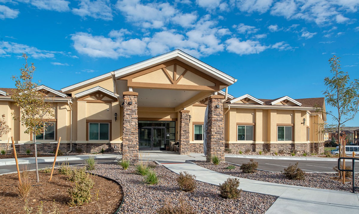 A modern building with a welcoming entrance on a sunny day.