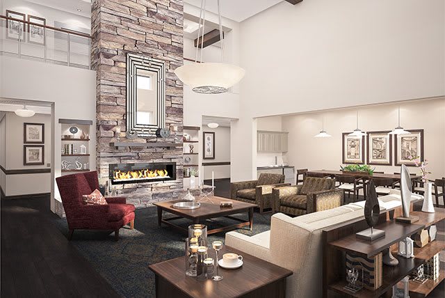 A modern living room featuring a stone fireplace, cozy seating, and elegant interior design.