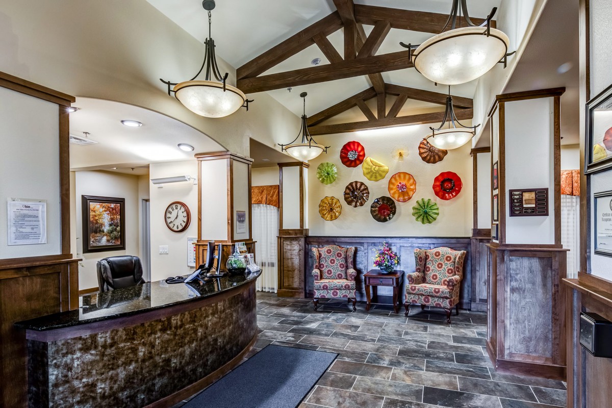 A welcoming lobby featuring artistic wall decor and comfortable seating.