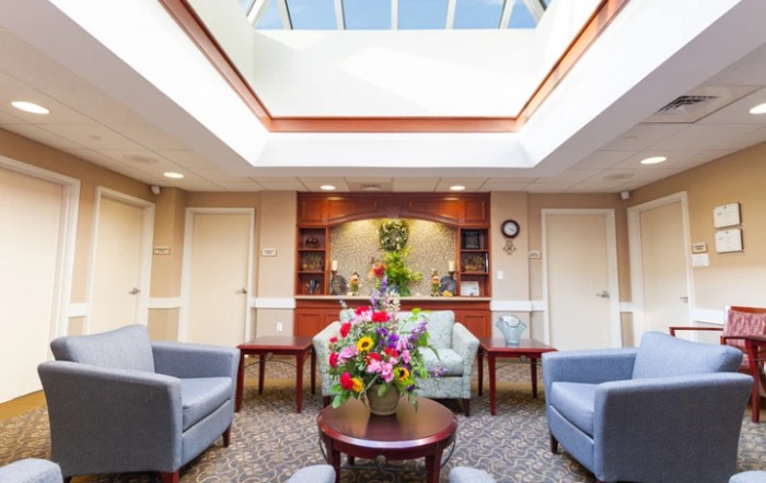 A welcoming lobby area with comfortable seating and a skylight.